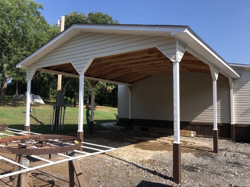 White carport and pavilion under construction